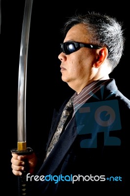 Business Man Holding Sword Stock Photo