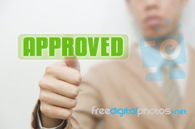 Business Man Pressing Touch Screen Approve Button Stock Photo