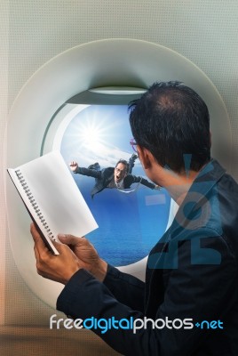 Business Man Reading Book In Passenger Plane Seat And Looking To… Stock Photo