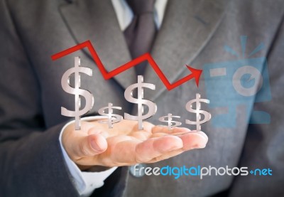 Business Man Showing Dollar Graph Stock Photo