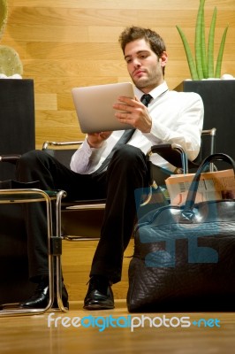 Business Man Waiting With Ipad Stock Photo