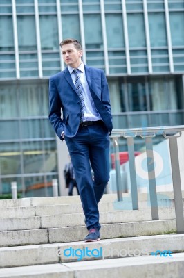 Business Man Walking Down Some Steps Stock Photo