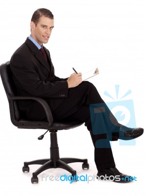 Business Man With Notepad Stock Photo