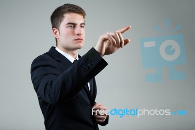 Business Man With Pointing To Something Or Touching A Screen Stock Photo
