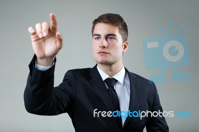 Business Man With Pointing To Something Or Touching A Screen Stock Photo