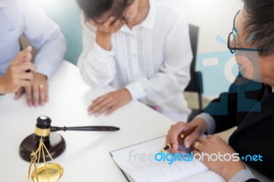 Business People And Lawyers Discussing Contract Papers Sitting A… Stock Photo