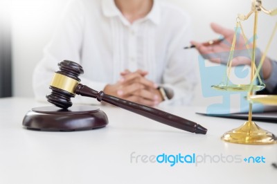 Business People And Lawyers Discussing Contract Papers Sitting A… Stock Photo