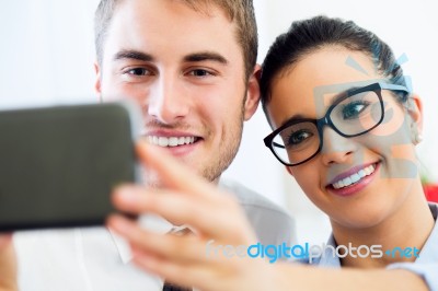 Business People Taking A Selfie In The Office Stock Photo