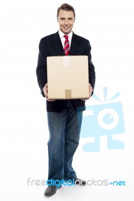 Business Representative Holding Cardboard Box Stock Photo