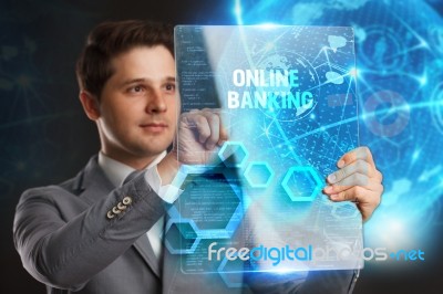 Business, Technology, Internet And Network Concept. Young Businessman Showing A Word In A Virtual Tablet Of The Future: Online Banking Stock Photo