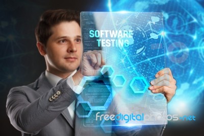 Business, Technology, Internet And Network Concept. Young Businessman Showing A Word In A Virtual Tablet Of The Future: Software Testing Stock Photo