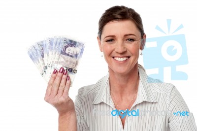 Business Woman Holding Fan Of Currency Notes Stock Photo