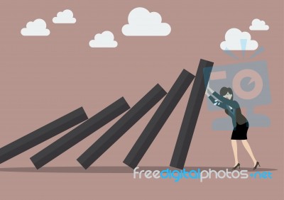 Business Woman Pushing Hard Against Falling Deck Of Domino Tiles… Stock Image