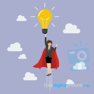 Business Woman Superhero Holding Creative Lightbulb Stock Image