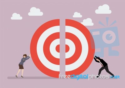 Businessman And Woman Pushing A Pieces Of Big Target Together Stock Image