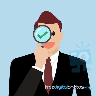 Businessman Check The Quality Through A Magnifying Glass Stock Image