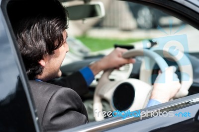 Businessman Driving His Luxury Dream Car Stock Photo