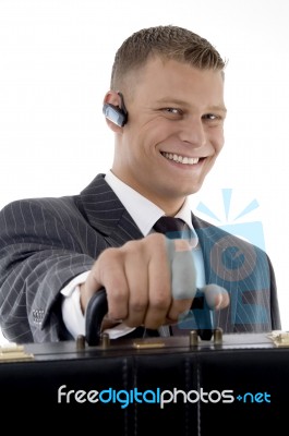 Businessman giving his Briefcase Stock Photo