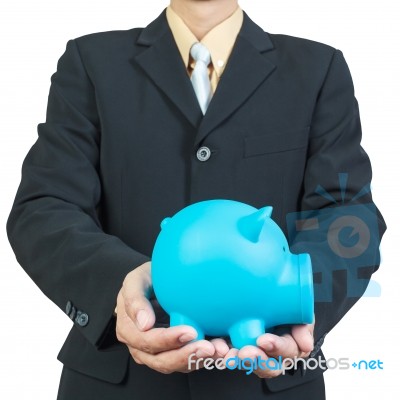 Businessman Hand Holding Piggy Bank On White Background Stock Photo