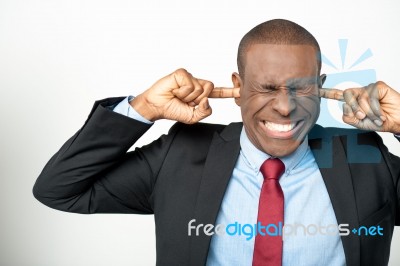 Businessman Hold Hands On Temples Ears Stock Photo