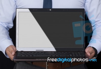 Businessman Holding A Laptop Stock Photo