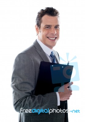 Businessman Holding Clipboard Stock Photo