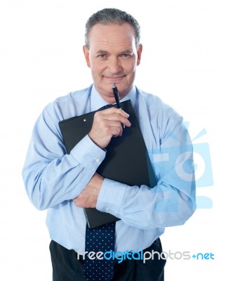 Businessman Holding Clipboard Stock Photo