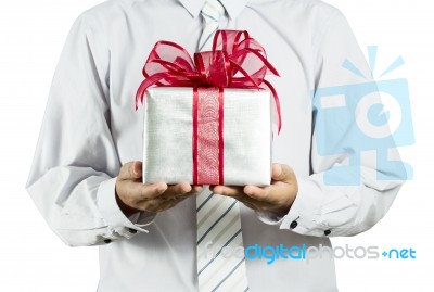 Businessman Holding Gift Box Stock Photo