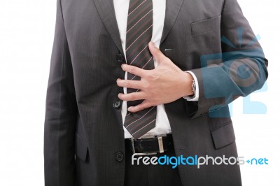 Businessman Holding His Stomach In Pain Or Indigestion Stock Photo