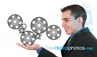 Businessman Holding Mechanism Stock Photo