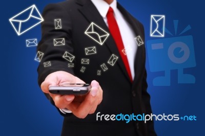 Businessman Holding Smart Phone Stock Photo