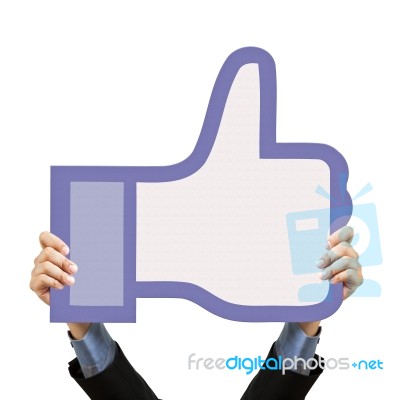 Businessman Holding Thumb Up Sign Stock Photo
