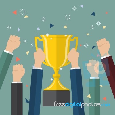 Businessman Holding Up A Winning Trophy Stock Image