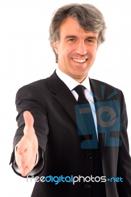 Businessman Holds Out His Hand Stock Photo