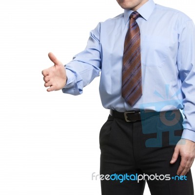 Businessman In Blue Shirt Holds Hand Welcome Gesture, Offering A… Stock Photo