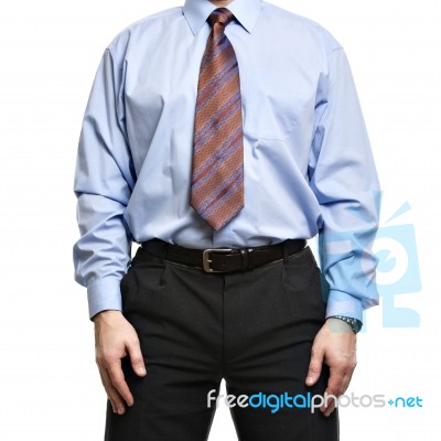 Businessman In Blue Shirt Stands With Hands On The Hips Stock Photo