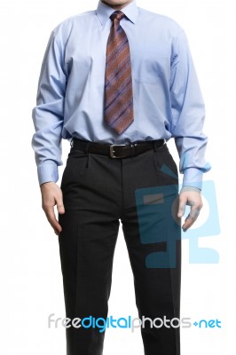 Businessman In Blue Shirt Stands With Hands On The Hips Stock Photo