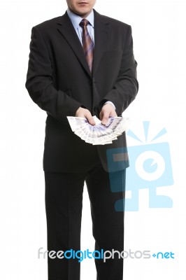 Businessman In Dark Suit With A Bunch Of British Pounds Sterling… Stock Photo