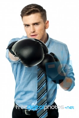 Businessman In Punching Posture Stock Photo
