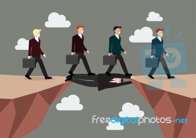 Businessman Is Laying Down Across The Cliff Stock Image