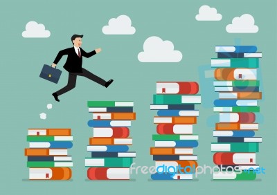 Businessman Jumping Over Higher Stack Of Books Stock Image