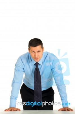 Businessman Leaning On Desk Stock Photo