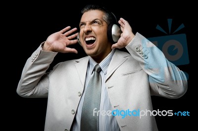 Businessman Listening Music Stock Photo