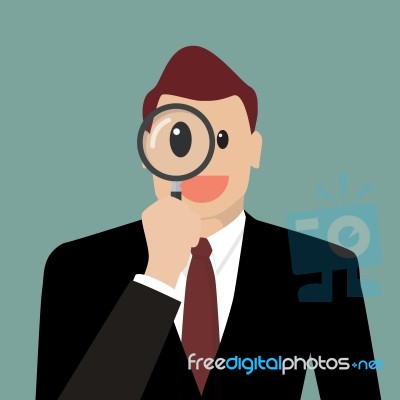 Businessman Looking Through A Magnifying Glass Stock Image