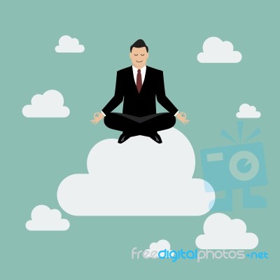 Businessman Meditating On A Cloud Stock Image