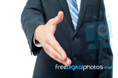 Businessman Offering For Handshake Stock Photo