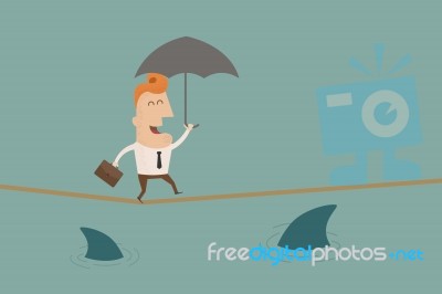 Businessman On A Suspended Rope Stock Image