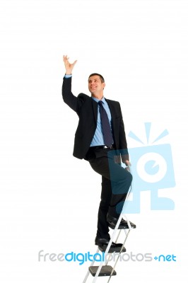 Businessman On Ladder Stock Photo