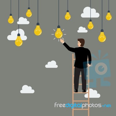 Businessman On The Ladder Catching A Light Bulb Idea Stock Image