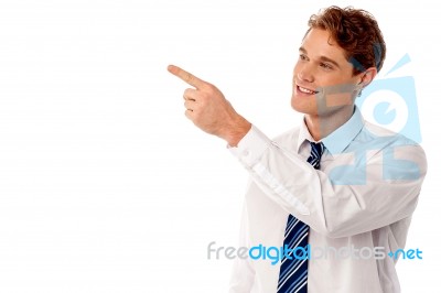Businessman Pointing At Something Stock Photo